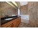 Bathroom with a double sink vanity, soaking tub, and tile flooring at 415 Smiley Ct, Winter Haven, FL 33884