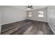 Spacious bedroom featuring modern flooring and ceiling fan for added comfort at 415 Smiley Ct, Winter Haven, FL 33884