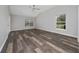 Spacious bedroom with wood flooring and a ceiling fan at 415 Smiley Ct, Winter Haven, FL 33884
