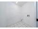 Functional laundry room with white tile floors and bright lighting at 415 Smiley Ct, Winter Haven, FL 33884