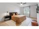 Light-filled bedroom with a queen-sized bed, modern nightstands, and a large window at 4768 Tangerine Ave # 4768, Winter Park, FL 32792