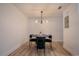 Clean and modern dining area with minimalist decor, stylish light fixture, and seating for four at 4768 Tangerine Ave # 4768, Winter Park, FL 32792