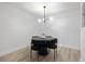Clean dining area with round table, unique lighting fixture, and modern finishes at 4768 Tangerine Ave # 4768, Winter Park, FL 32792
