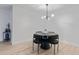Bright dining room features modern furnishings, minimalist style and chandelier at 4768 Tangerine Ave # 4768, Winter Park, FL 32792