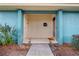 Welcoming covered entryway featuring a well-lit walkway and a neatly kept garden at 4768 Tangerine Ave # 4768, Winter Park, FL 32792
