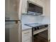 Updated kitchen with stainless steel appliances and white countertops at 4768 Tangerine Ave # 4768, Winter Park, FL 32792