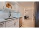 Modern kitchen with white cabinetry, quartz countertops, stainless steel appliances, and stylish fixtures at 4768 Tangerine Ave # 4768, Winter Park, FL 32792