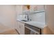 Updated kitchen with stainless steel appliances and white countertops at 4768 Tangerine Ave # 4768, Winter Park, FL 32792