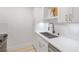 Modern kitchen with white cabinets, stainless steel appliances, and bright countertop space at 4768 Tangerine Ave # 4768, Winter Park, FL 32792