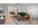 Inviting living room featuring modern furnishings, light wood floors, and a stylish area rug at 4768 Tangerine Ave # 4768, Winter Park, FL 32792