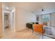 Bright living room with sleek flooring, modern décor, and a view into an adjacent bathroom at 4768 Tangerine Ave # 4768, Winter Park, FL 32792