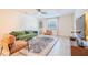 Stylish living room with modern furnishings, neutral tones, a ceiling fan, and lots of natural light at 4768 Tangerine Ave # 4768, Winter Park, FL 32792