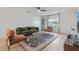 Bright living room features modern furnishings, sleek ceiling fan and a large window at 4768 Tangerine Ave # 4768, Winter Park, FL 32792