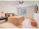 Main bedroom with ensuite bathroom, closet, and ample natural light at 4768 Tangerine Ave # 4768, Winter Park, FL 32792