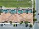 Top-down aerial view of condos with private screened-in pools, parking, and well-maintained landscaping at 4981 Windermere Ave, Kissimmee, FL 34746