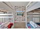 Charming ' bedroom with bunk beds, themed wallpaper, and a wall-mounted TV at 4981 Windermere Ave, Kissimmee, FL 34746