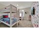 Whimsical ' room featuring bunk beds, Disney-themed decor, and a mounted TV at 4981 Windermere Ave, Kissimmee, FL 34746