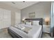 Comfortable bedroom features a cozy bed, stylish nightstands, and soft, neutral tones at 4981 Windermere Ave, Kissimmee, FL 34746