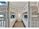 Comfortable bedroom featuring two white bunk beds, side table, neutral colors, and playful decor at 4981 Windermere Ave, Kissimmee, FL 34746