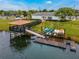 View of the community kayak launch and rack with multiple kayaks for resident use at 4981 Windermere Ave, Kissimmee, FL 34746