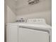 Clean and modern laundry room with a white washer and dryer at 4981 Windermere Ave, Kissimmee, FL 34746