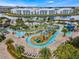 Beautiful aerial view of the community lazy river, swimming pool, mini golf, and clubhouse at 4981 Windermere Ave, Kissimmee, FL 34746
