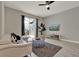 Inviting living room featuring contemporary furniture, a large sliding glass door, sleek tile flooring, and stylish accents at 4981 Windermere Ave, Kissimmee, FL 34746
