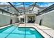Inviting outdoor pool area with ample lounge space, patio, and screened enclosure at 4981 Windermere Ave, Kissimmee, FL 34746