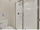 Modern bathroom featuring a glass door shower with sleek design and tiled walls at 4981 Windermere Ave, Kissimmee, FL 34746