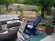 Back patio with cozy seating, attractive area rug, and a lovely garden view at 505 Oak Dr, Tavares, FL 32778