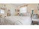 Inviting bedroom with cozy bedding, natural light, and comfortable decor at 505 Oak Dr, Tavares, FL 32778