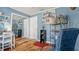 Stylish bedroom showcases bright blue walls, ample closet space, and modern decor at 505 Oak Dr, Tavares, FL 32778