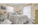 Inviting bedroom with cozy bedding, natural light, and comfortable decor at 505 Oak Dr, Tavares, FL 32778
