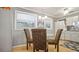 This dining room features a modern chandelier, tile flooring and large windows at 505 Oak Dr, Tavares, FL 32778
