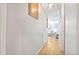 Bright hallway featuring hardwood floors and doorways to other rooms at 505 Oak Dr, Tavares, FL 32778