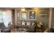 Cozy living room featuring a comfortable sofa, decorative wall art and neutral color scheme at 505 Oak Dr, Tavares, FL 32778