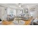 Comfortable living room featuring hardwood floors, neutral walls, and a cozy seating area at 505 Oak Dr, Tavares, FL 32778