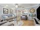 Inviting living room with stylish decor, hardwood floors, and comfortable seating arrangement at 505 Oak Dr, Tavares, FL 32778