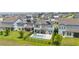 Aerial view of the home's backyard, pool and outdoor living spaces, and the surrounding community at 5133 Citrus Leaf Blvd, Winter Garden, FL 34787