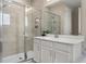Modern bathroom featuring glass shower with decorative tile accents and white vanity at 5133 Citrus Leaf Blvd, Winter Garden, FL 34787