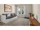 Bright bedroom featuring large windows, a comfortable daybed, and a cozy atmosphere at 5133 Citrus Leaf Blvd, Winter Garden, FL 34787