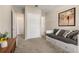 Neutral bedroom features a closet, decor art and a comfy looking daybed at 5133 Citrus Leaf Blvd, Winter Garden, FL 34787