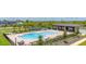Community pool with lounge seating and tennis courts at 5133 Citrus Leaf Blvd, Winter Garden, FL 34787