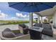 Outdoor seating area featuring comfortable seating and a beautiful water view at 5133 Citrus Leaf Blvd, Winter Garden, FL 34787