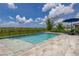 Backyard pool with a sundeck, umbrella, and lounge chairs overlooking a lush greenbelt at 5133 Citrus Leaf Blvd, Winter Garden, FL 34787