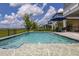 Sparkling pool with a fountain feature, surrounded by lounge chairs and lush landscaping at 5133 Citrus Leaf Blvd, Winter Garden, FL 34787