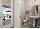 Powder room providing convenient access to the outdoor patio and pool area at 5133 Citrus Leaf Blvd, Winter Garden, FL 34787