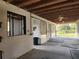 Spacious barn interior with concrete floors, a ceiling fan, and multiple stalls for animals or storage at 600 Lake Butler Ave, Osteen, FL 32764