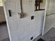 Barn interior with electric outlets, concrete block walls, metal stall door, and concrete floor for a secure environment at 600 Lake Butler Ave, Osteen, FL 32764