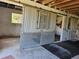 Interior of barn features metal stall doors and concrete flooring, providing a safe and secure environment for animals at 600 Lake Butler Ave, Osteen, FL 32764